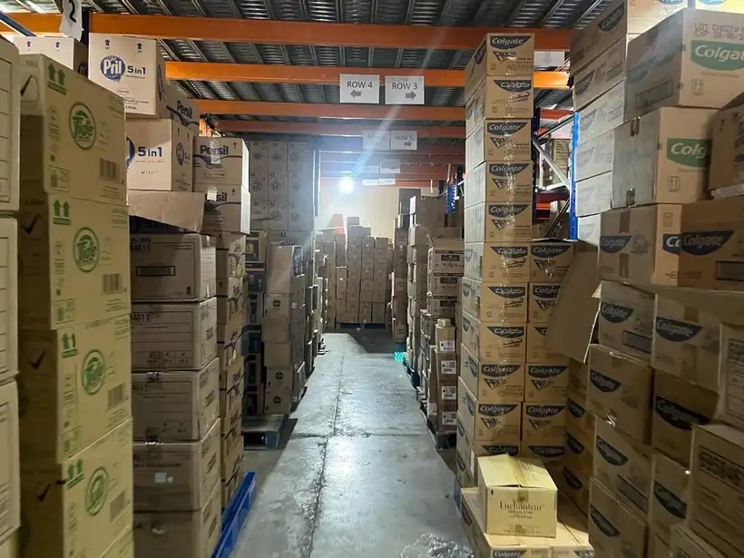NOWA warehouse aisle stocked with FMCG cases